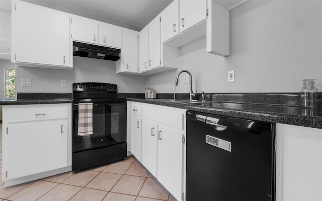 2614 W Idlewild Ave, Tampa, FL 33614 - kitchen with black appliances, under cabinet range hood, a textured ceiling, dark countertops, and white cabinets