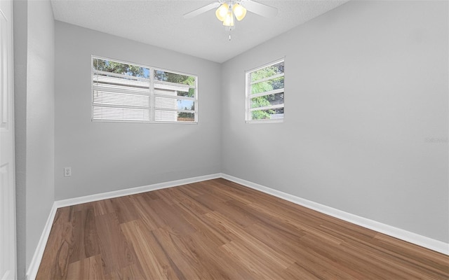 2614 W Idlewild Ave, Tampa, FL 33614 - empty room featuring wood finished floors, ceiling fan, and a textured ceiling