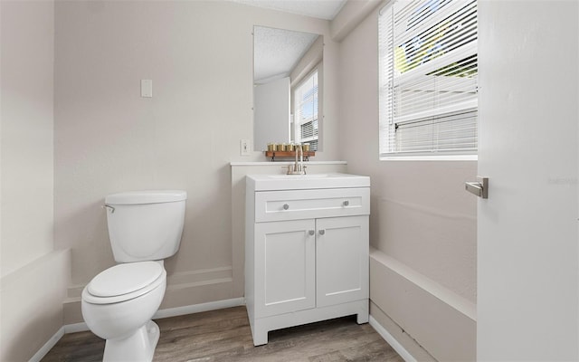 2614 W Idlewild Ave, Tampa, FL 33614 - bathroom with wood finished floors and vanity