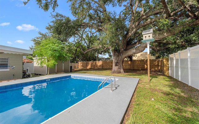 2614 W Idlewild Ave, Tampa, FL 33614 - view of swimming pool featuring a fenced backyard and a storage shed