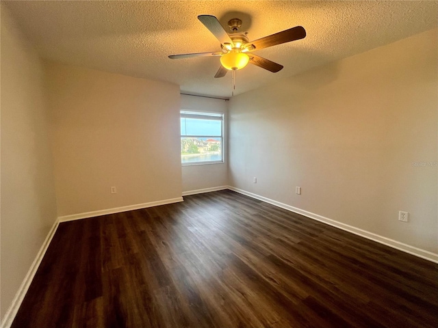 2400 Feather Sound Dr Unit 935, Clearwater, FL 33762 - spare room with dark wood-style floors, a ceiling fan, and a textured ceiling