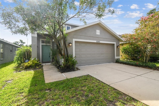 10343 Avelar Ridge Dr, Riverview, FL 33578 - traditional-style house featuring stucco siding, concrete driveway, an attached garage, and a front lawn