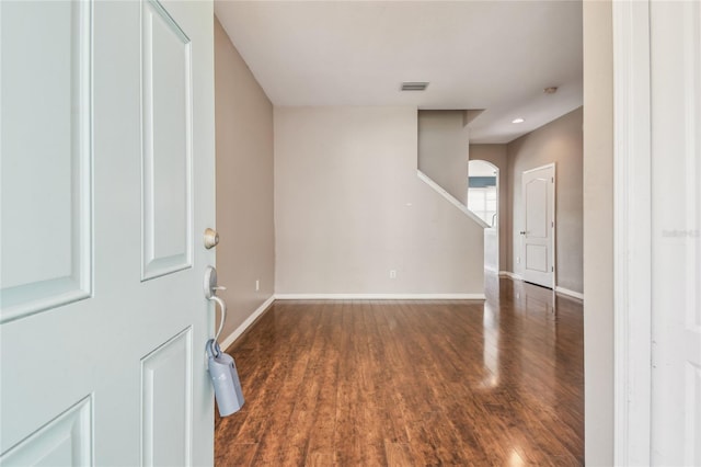 10343 Avelar Ridge Dr, Riverview, FL 33578 - foyer entrance with wood finished floors, arched walkways, and stairway