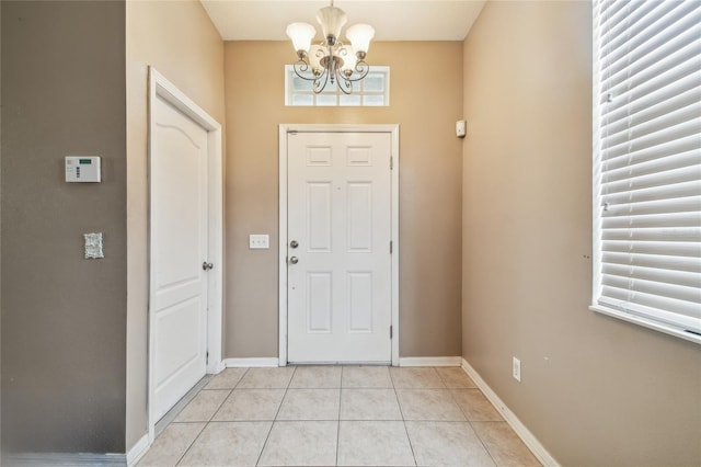 10343 Avelar Ridge Dr, Riverview, FL 33578 - entryway featuring a chandelier, light tile patterned floors, and plenty of natural light