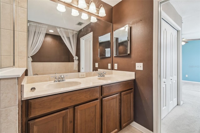 10343 Avelar Ridge Dr, Riverview, FL 33578 - bathroom featuring double vanity and baseboards