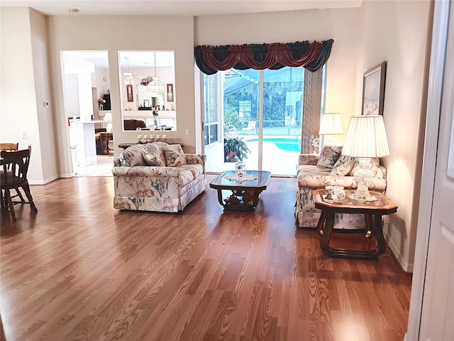 3740 Emerald Ln, Mulberry, FL 33860 - living area featuring wood finished floors and baseboards