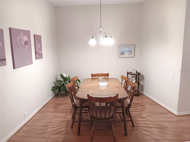 3740 Emerald Ln, Mulberry, FL 33860 - dining room with light wood-style floors and a chandelier