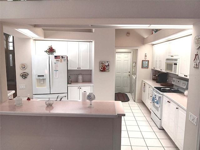 3740 Emerald Ln, Mulberry, FL 33860 - kitchen featuring white appliances, white cabinetry, light tile patterned floors, and light countertops