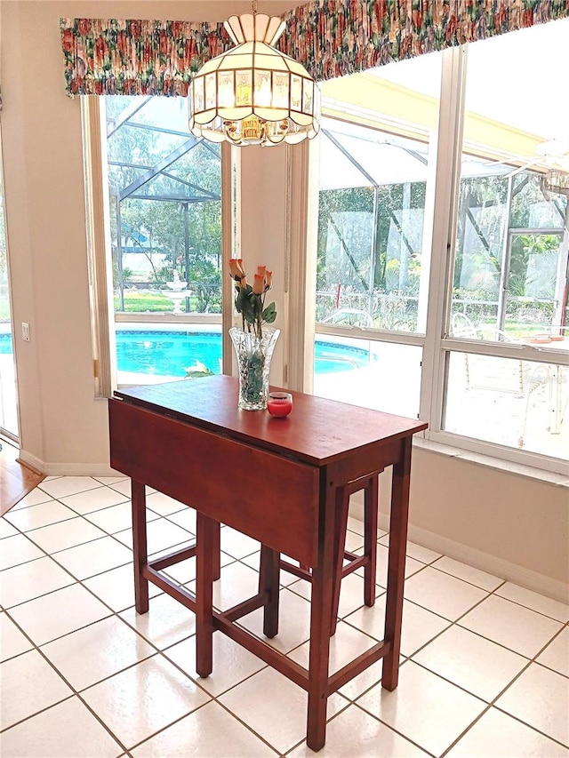 3740 Emerald Ln, Mulberry, FL 33860 - dining area featuring light tile patterned floors and healthy amount of natural light