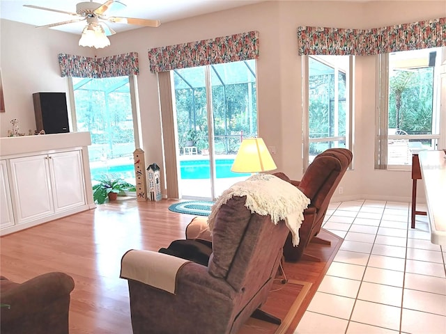 3740 Emerald Ln, Mulberry, FL 33860 - living area featuring healthy amount of natural light, light wood finished floors, and ceiling fan