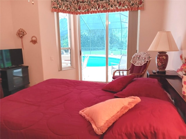 3740 Emerald Ln, Mulberry, FL 33860 - bedroom featuring access to exterior and multiple windows