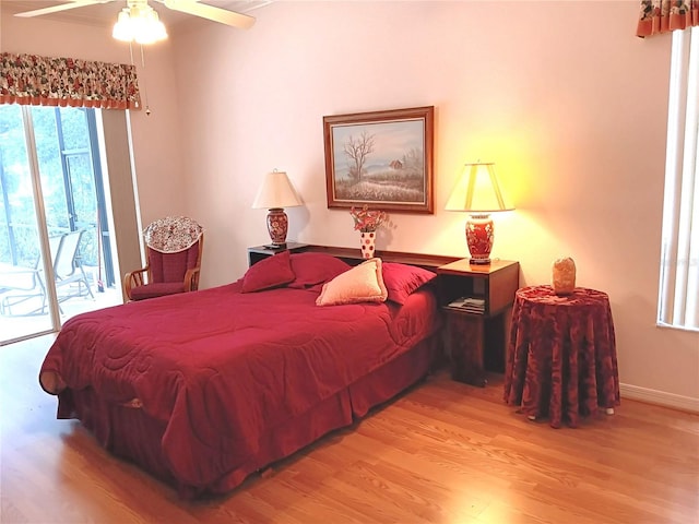 3740 Emerald Ln, Mulberry, FL 33860 - bedroom featuring access to exterior, wood finished floors, and ceiling fan