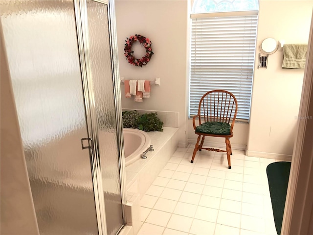 3740 Emerald Ln, Mulberry, FL 33860 - bathroom with a bath, a shower stall, and tile patterned flooring