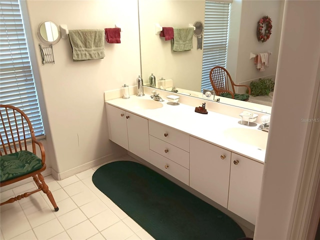 3740 Emerald Ln, Mulberry, FL 33860 - bathroom with double vanity and tile patterned flooring