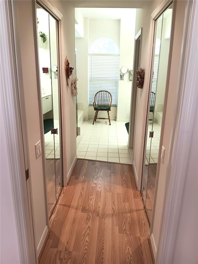3740 Emerald Ln, Mulberry, FL 33860 - hallway featuring wood finished floors and baseboards