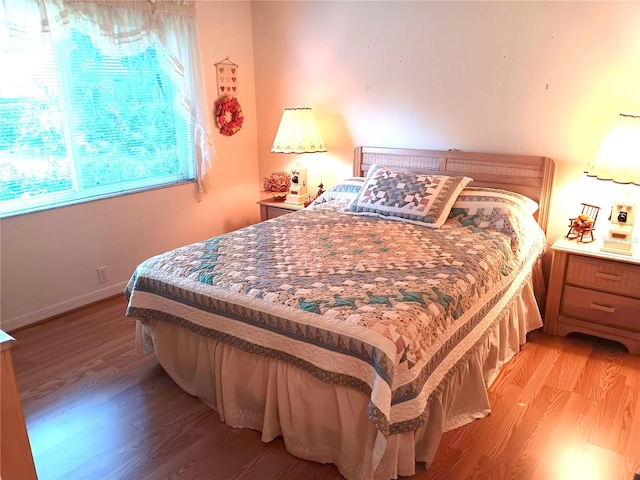 3740 Emerald Ln, Mulberry, FL 33860 - bedroom with light wood-style flooring and baseboards