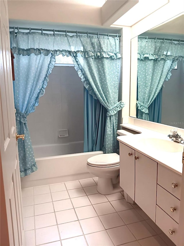 3740 Emerald Ln, Mulberry, FL 33860 - full bath featuring tile patterned floors, vanity, and shower / bath combo with shower curtain