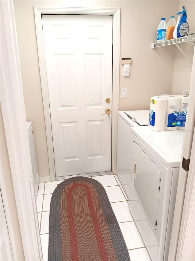 3740 Emerald Ln, Mulberry, FL 33860 - washroom with independent washer and dryer and light tile patterned floors