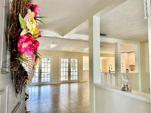 17017 Paula Ln, Lutz, FL 33558 - entrance foyer with tile patterned floors, french doors, and a textured ceiling