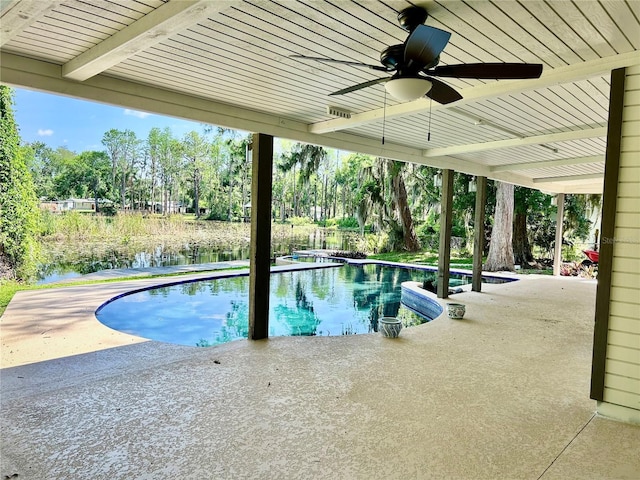 17017 Paula Ln, Lutz, FL 33558 - outdoor pool featuring a patio area, a ceiling fan, a water view, and view of scattered trees