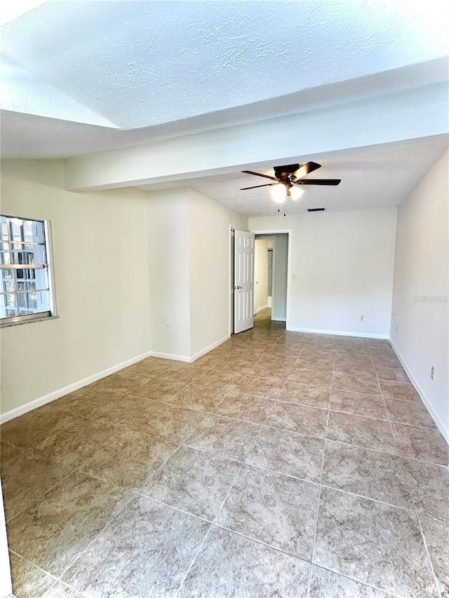 17017 Paula Ln, Lutz, FL 33558 - spare room featuring a ceiling fan, tile patterned flooring, and a textured ceiling
