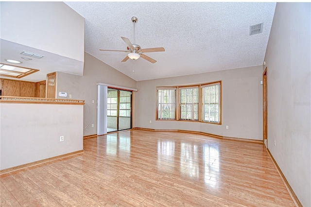 11070 Tilburg St, Spring Hill, FL 34608 - unfurnished living room featuring ceiling fan, a textured ceiling, wood finished floors, and high vaulted ceiling