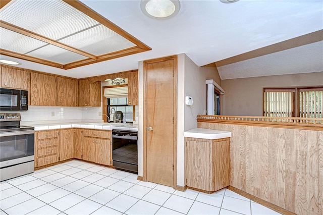 11070 Tilburg St, Spring Hill, FL 34608 - kitchen with black appliances, light tile patterned flooring, and tile countertops