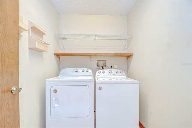 11070 Tilburg St, Spring Hill, FL 34608 - washroom with washer and clothes dryer and a textured ceiling