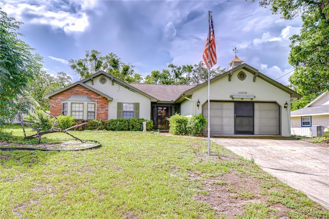 11070 Tilburg St, Spring Hill, FL 34608 - single story home featuring concrete driveway, a front yard, a garage, and stucco siding