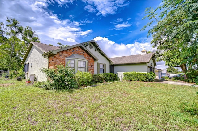 11070 Tilburg St, Spring Hill, FL 34608 - ranch-style house with stucco siding, an attached garage, and driveway