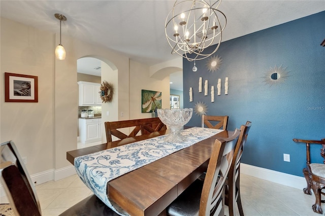 5642 Simonton St, Bradenton, FL 34203 - dining space with arched walkways, light tile patterned flooring, and a chandelier