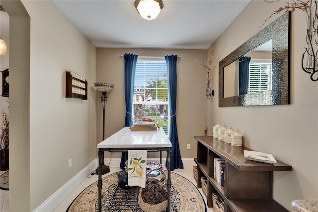 5642 Simonton St, Bradenton, FL 34203 - tiled home office featuring arched walkways and baseboards