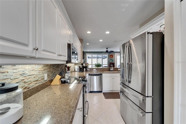 5642 Simonton St, Bradenton, FL 34203 - kitchen with stainless steel appliances, tasteful backsplash, white cabinetry, a ceiling fan, and recessed lighting