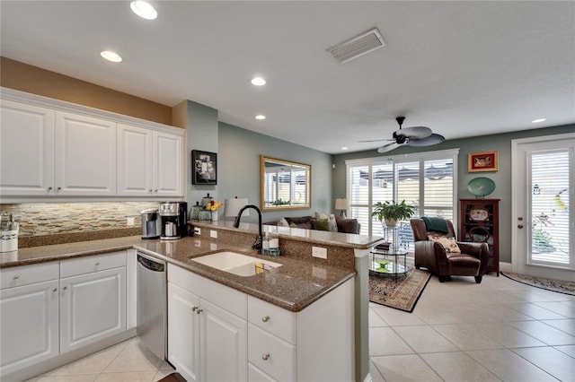 5642 Simonton St, Bradenton, FL 34203 - kitchen featuring a peninsula, dishwasher, open floor plan, recessed lighting, and light tile patterned floors
