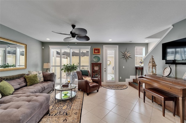 5642 Simonton St, Bradenton, FL 34203 - living area with ceiling fan, light tile patterned floors, plenty of natural light, recessed lighting, and a textured ceiling