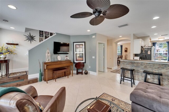 5642 Simonton St, Bradenton, FL 34203 - living area with a ceiling fan, arched walkways, recessed lighting, and light tile patterned floors