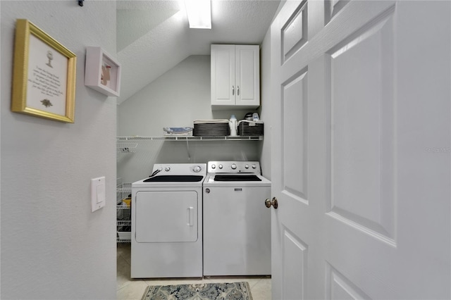 5642 Simonton St, Bradenton, FL 34203 - laundry room with cabinet space, washer and clothes dryer, a textured ceiling, and light tile patterned floors