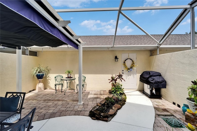 5642 Simonton St, Bradenton, FL 34203 - view of patio / terrace featuring glass enclosure and grilling area