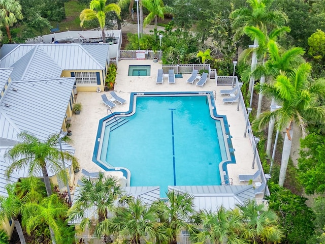 5642 Simonton St, Bradenton, FL 34203 - community pool featuring a patio, a community hot tub, and view of scattered trees