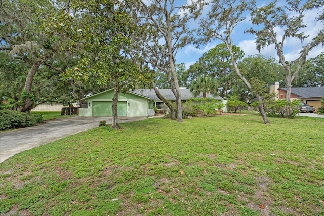 8470 Cranes Roost Dr, New Port Richey, FL 34654 - view of front of home with driveway, a front lawn, and a garage