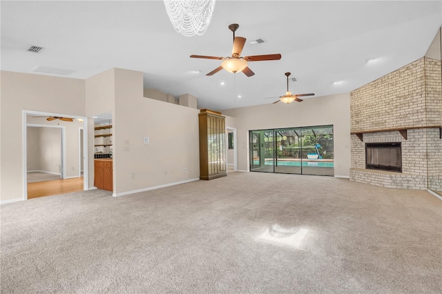 8470 Cranes Roost Dr, New Port Richey, FL 34654 - unfurnished living room featuring a ceiling fan, carpet flooring, a brick fireplace, recessed lighting, and high vaulted ceiling