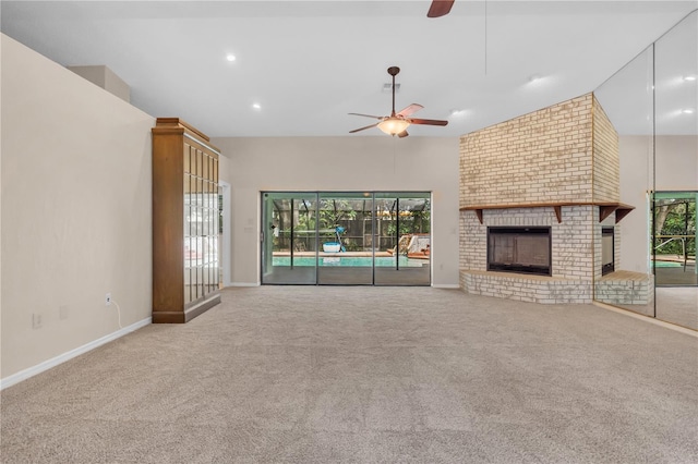8470 Cranes Roost Dr, New Port Richey, FL 34654 - unfurnished living room featuring ceiling fan, carpet floors, a fireplace, vaulted ceiling, and recessed lighting