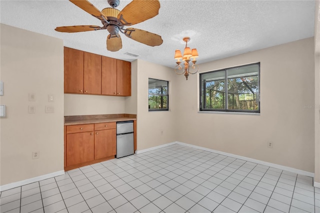 8470 Cranes Roost Dr, New Port Richey, FL 34654 - unfurnished room with a chandelier, a textured ceiling, and ceiling fan