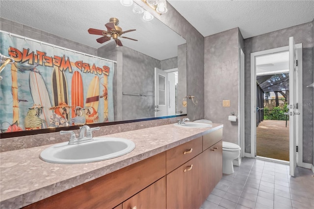 8470 Cranes Roost Dr, New Port Richey, FL 34654 - bathroom with double vanity, tile patterned flooring, a textured ceiling, a ceiling fan, and a shower with shower curtain