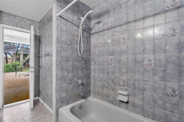 8470 Cranes Roost Dr, New Port Richey, FL 34654 - bathroom with a textured ceiling, tile patterned flooring, and bathtub / shower combination