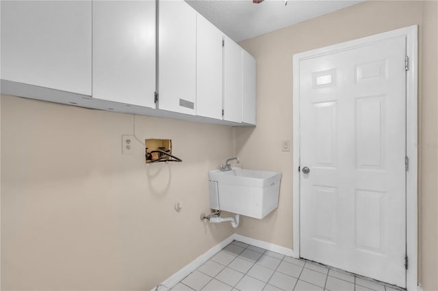 8470 Cranes Roost Dr, New Port Richey, FL 34654 - laundry area featuring cabinet space, light tile patterned floors, and hookup for a washing machine