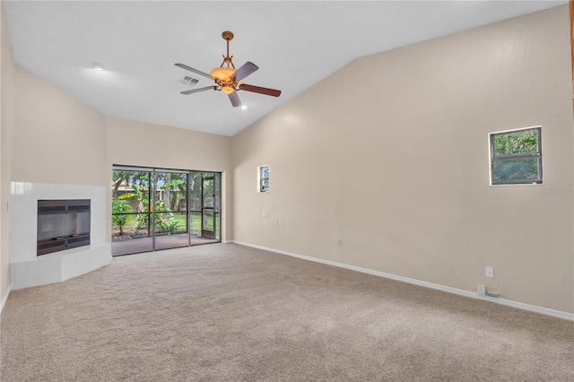 8470 Cranes Roost Dr, New Port Richey, FL 34654 - unfurnished living room with ceiling fan, carpet, a fireplace, and high vaulted ceiling