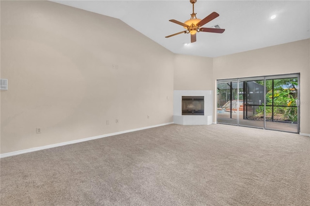 8470 Cranes Roost Dr, New Port Richey, FL 34654 - unfurnished living room with vaulted ceiling, carpet floors, a fireplace with raised hearth, ceiling fan, and recessed lighting