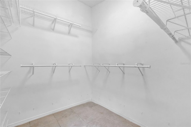 8470 Cranes Roost Dr, New Port Richey, FL 34654 - spacious closet with tile patterned flooring