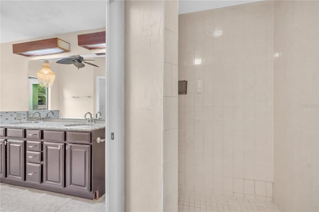 8470 Cranes Roost Dr, New Port Richey, FL 34654 - full bathroom with ceiling fan, double vanity, tile patterned floors, and tiled shower